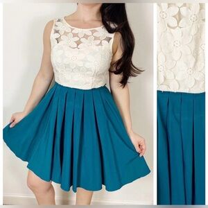 Lace top cream color with teal plisse skirt. Elegant cute dress